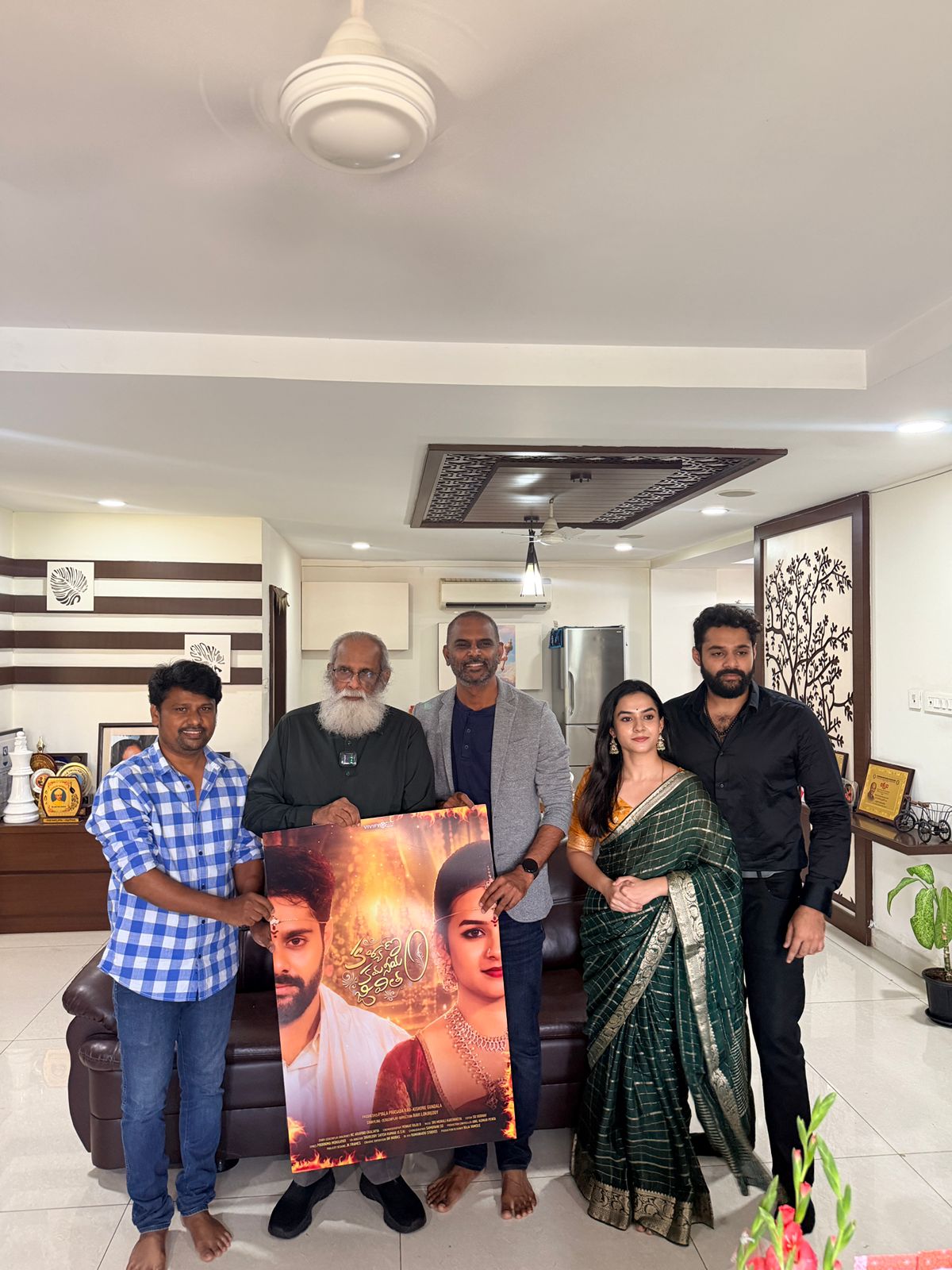 The Kalyanam Kamaniyam Jeevitam team presenting the unveiled poster